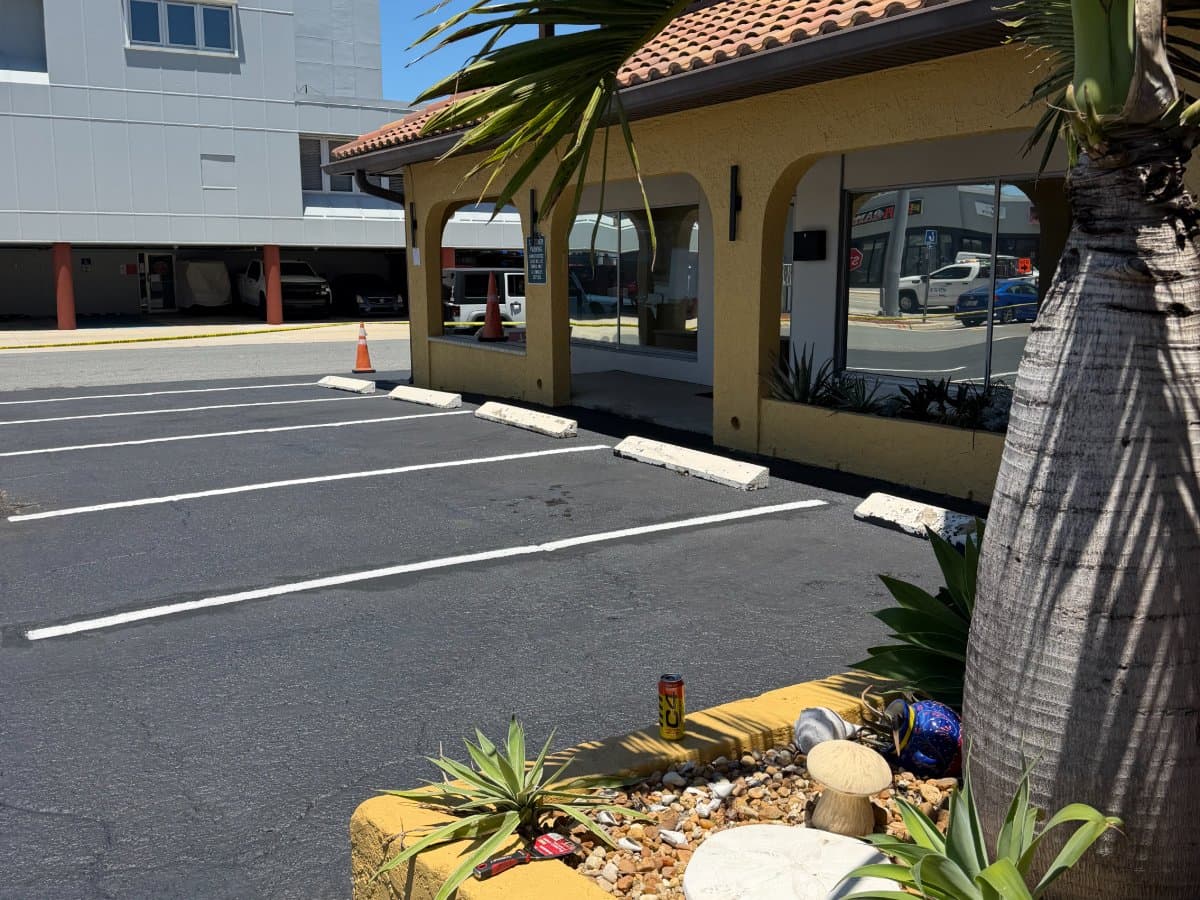 Fresh white striping on a commercial parking lot